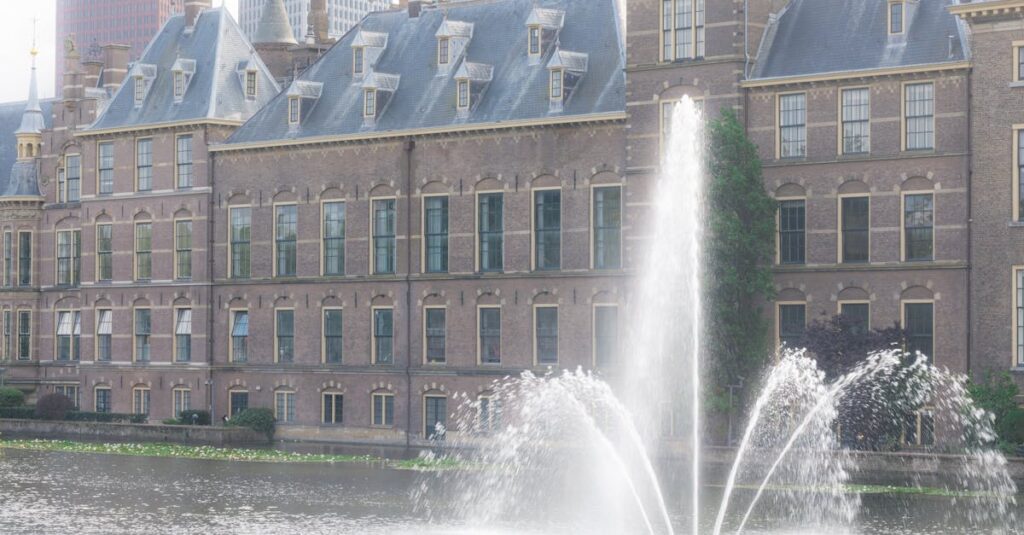 Scenic view of the Binnenhof government complex and water fountain in The Hague, Netherlands.