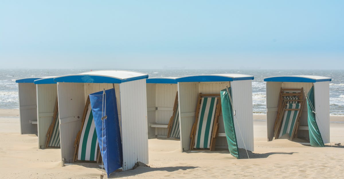 Sunny view of beach huts on the sands of Katwijk aan Zee in summer.