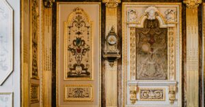 Luxurious gilded interior details featuring classic French architecture in a historical Rennes building.